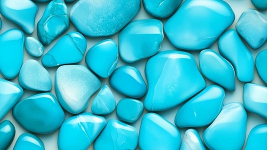 A collection of smooth polished turquoise stones arranged close