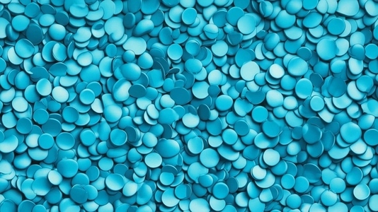 A close up view of numerous small round turquoise discs scatter