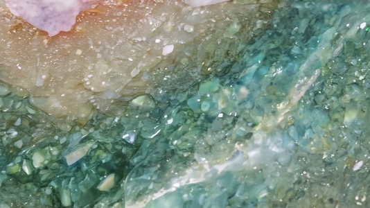 Close up of a textured green and brown Unakite surface