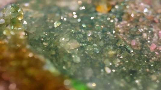 Close up of sparkling green and yellow Unakite crystals