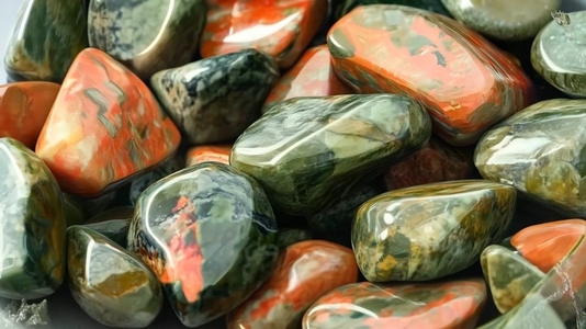 Close up of polished colorful Unakite stones