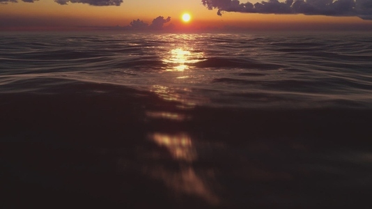 Golden Ocean Sunset Horizon with Reflecting Waves