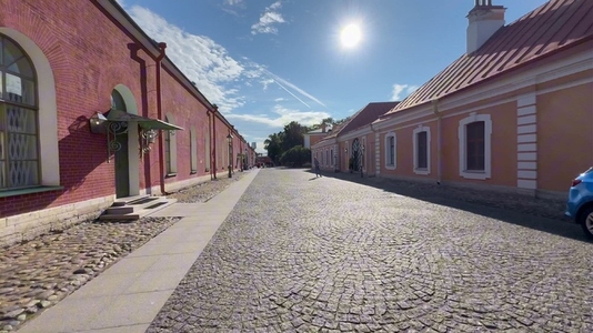 Cobblestone time street with historic buildings under a clear sk