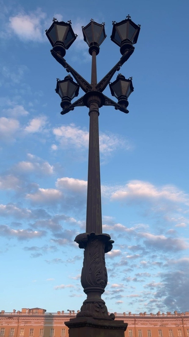 A timelapse tall vintage street lamp with multiple light fixture