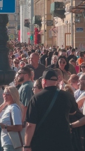 A bustling street filled with a diverse crowd of people walking A bustling street filled with a diverse crowd of people walking