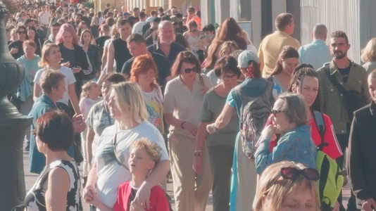 A large crowd of people walking on a sunny day on Nevsky prospec A large crowd of people walking on a sunny day on Nevsky prospec