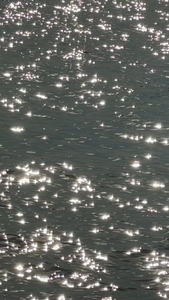 Sparkling water surface with sunlight reflections