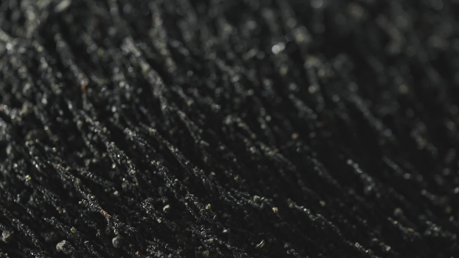 Magnetic Volcanic Sand Macro Flowing With Magnetic Field