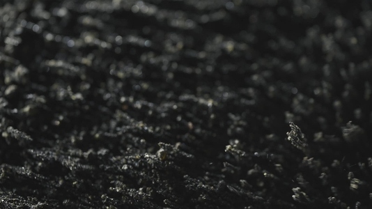 Black Volcanic Particles Moving With Magnetic Field