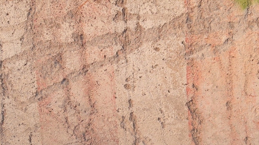 A textured surface with earthy tones background