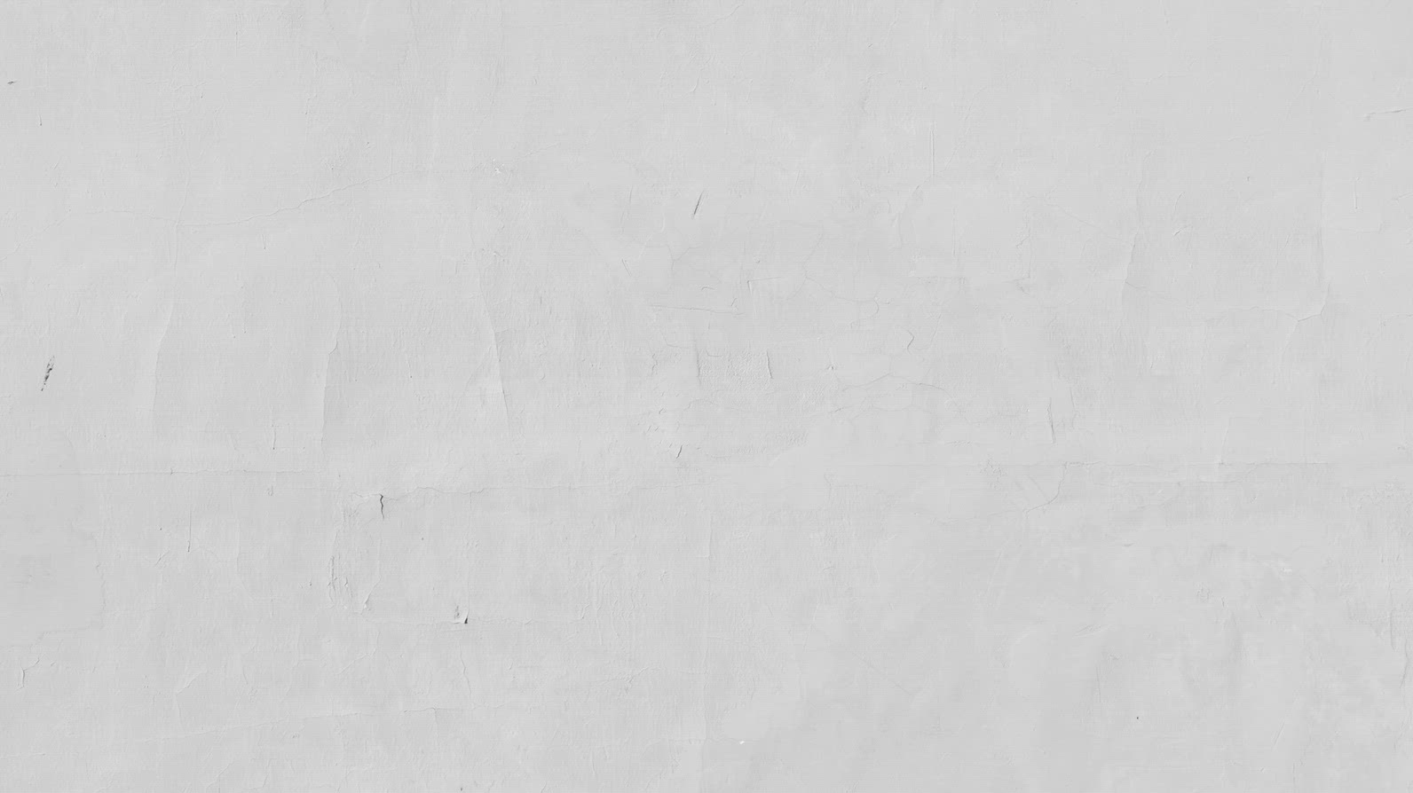 A smooth, light gray concrete wall background texture