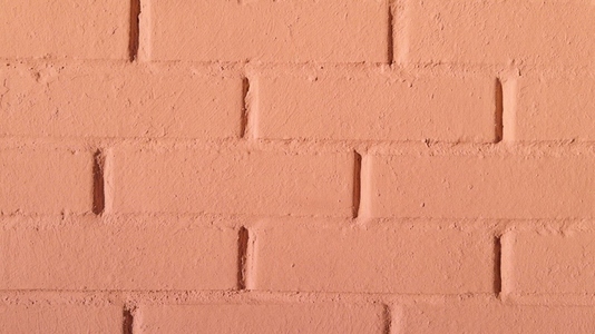 A close up view of a textured brick wall background