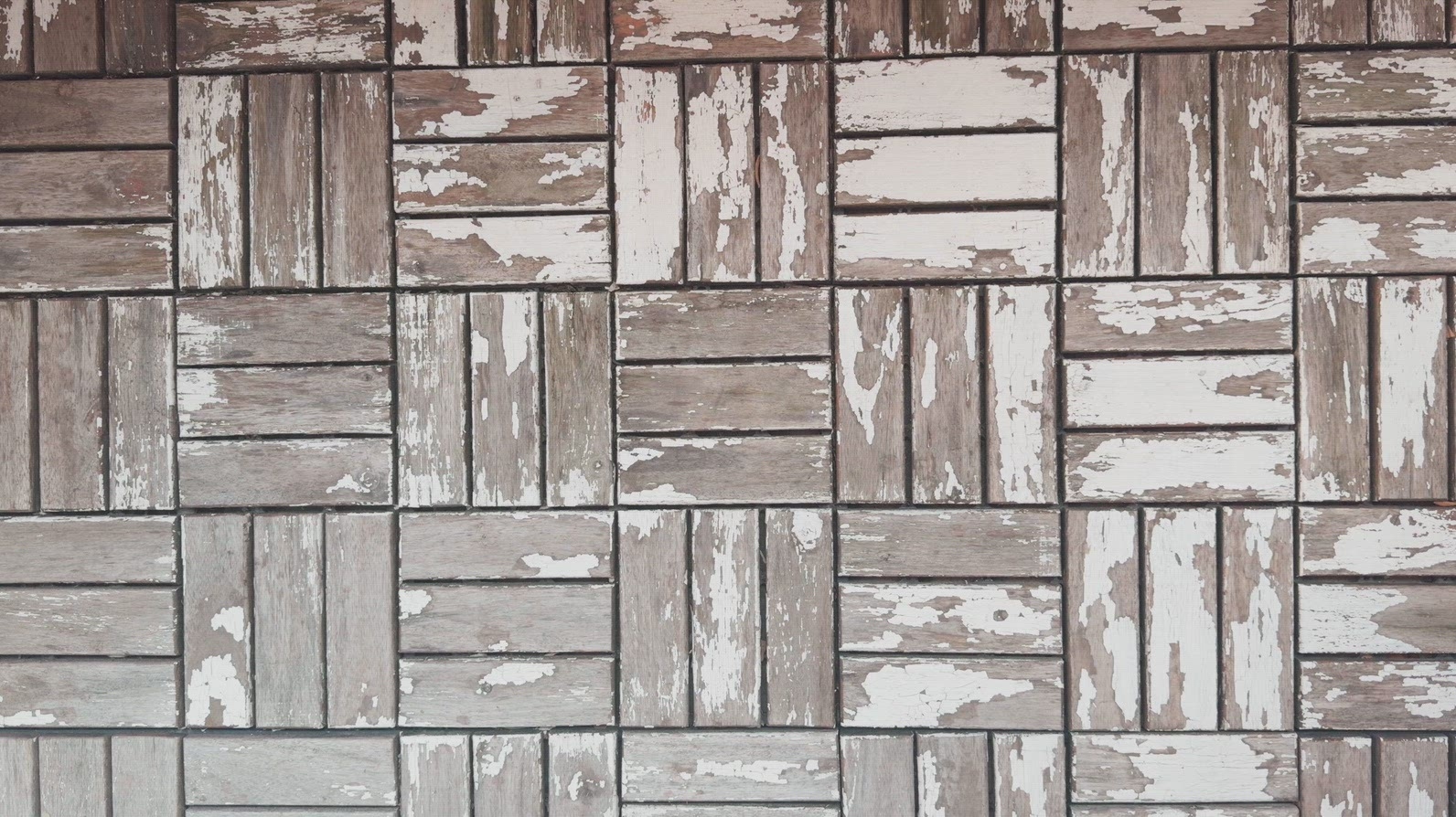 A textured wall background featuring a pattern of weathered wood