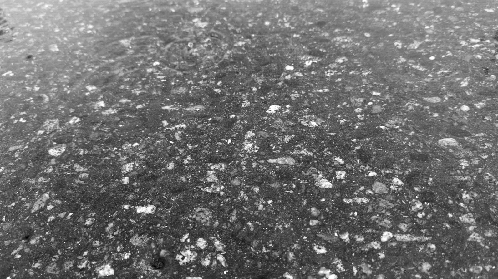 Seamless loop texture background surface with a mix of dark